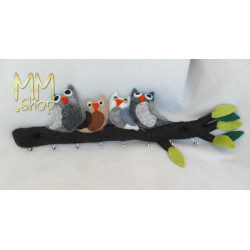 Coat rack owls on a branch in brown and grey