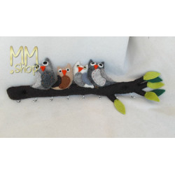 Coat rack owls on a branch in brown and grey